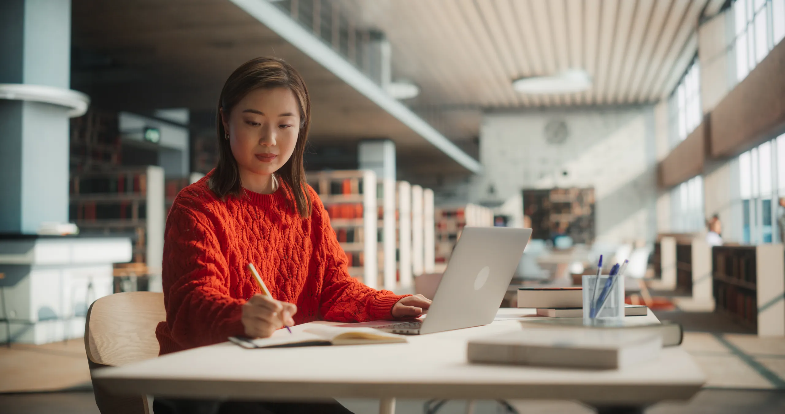 A researcher working in a university library