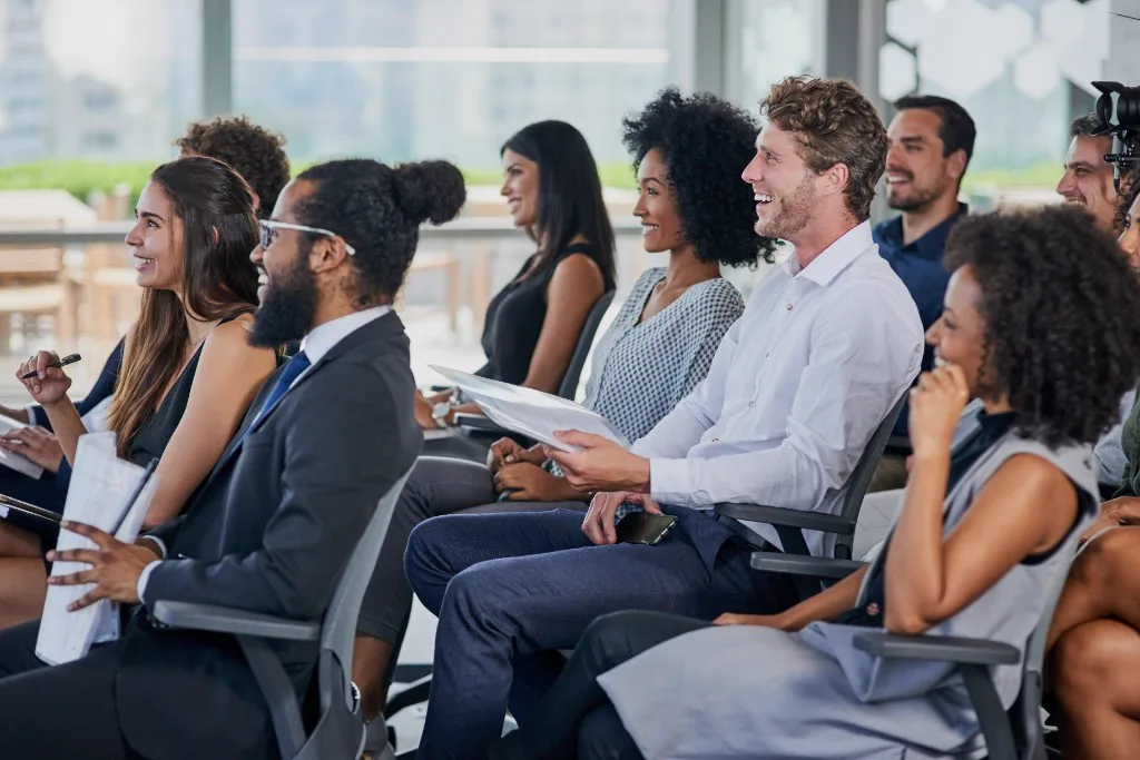 Trainees seated in a seminar audience